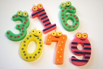 Number 97 party candle isolated on white background, close-up with copy space.