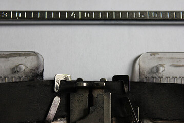 White blank sheet of paper in a typewriter for writers, poets, writing literary works. Prose, poetry, novels, poems. Professional equipment. Art and creativity. School stuff. Fiction, fairy tales