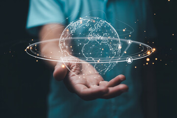 Person holding a futuristic digital globe representing global connectivity