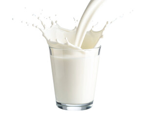 Fresh milk pouring into clear glass with dynamic splash on pastel background PNG