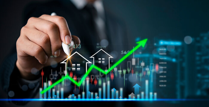 Businessman drawing rising green arrow with house icons, real estate investment growth, property market analysis and housing financial success concept.