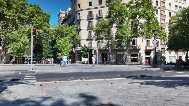 Timelapse of tourists and locals walking in Rambla de Catalunya, Barcelona, Spain