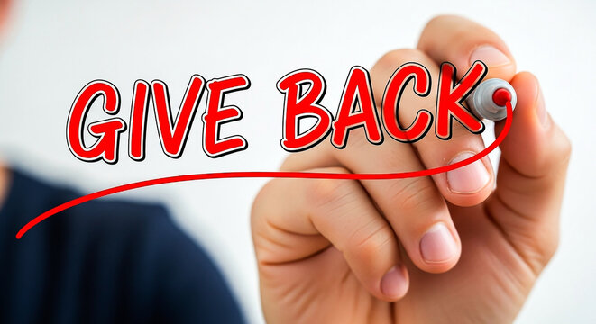 Hand writing give back with a red marker on a clear surface inspiring acts of kindness and community support for a better future.