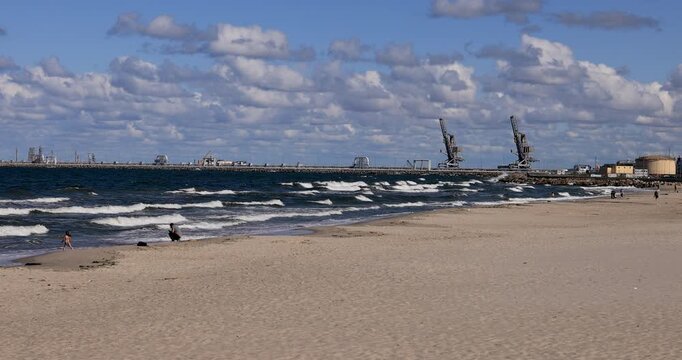 Gdansk Poland Baltic Sea sandy beach harbor. Baltic coast of northern Poland. World War II started here with German invasion. Economic international port. Historical buildings, tourism.