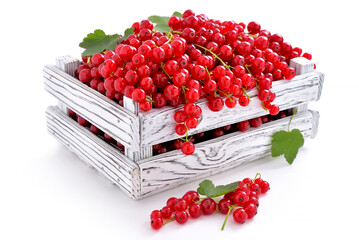 ripe fresh red currants in wooden box on light background, berry season