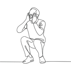 Man in deep thought or distress with hands covering face