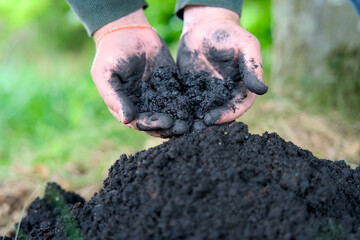 Adding biochar to soil for improving fertility and CO2 reduction. It enhances soil health and promotes sustainable carbon storage. Carbon farming, sustainable farming.