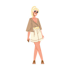 Smiling blonde woman posing wearing summer outfit