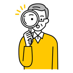 虫眼鏡を覗く年配の男性