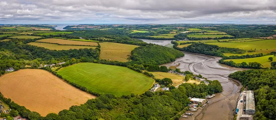 Tableau sur plexiglas Prairie, marais Aerial view of Gweek village with surrounding green fields and countryside  © Alexey Fedorenko