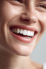 Fototapeta premium Closeup of a radiant, genuine smile, showcasing bright, healthy teeth. Perfect for dental care, beauty, or happiness concepts. Inspires confidence, positivity, and wellbeing.
