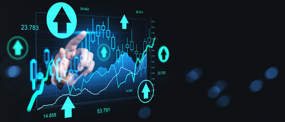 Businessman hand pointing at rising financial chart with glowing blue arrows and candlestick data on dark background, symbolizing growth concept.
