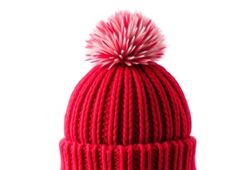 A warm red knitted wool cap with a tassel is a stylish winter accessory