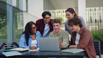 Group of students studying with laptop preparing for exams and working on University project at campus Library - Powered by Adobe