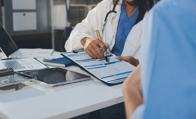 Young brunette woman having consultation at doctor office during
