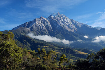 Fototapeta premium Majestic mountains with snow-capped peaks, green valleys below, clean and natural air