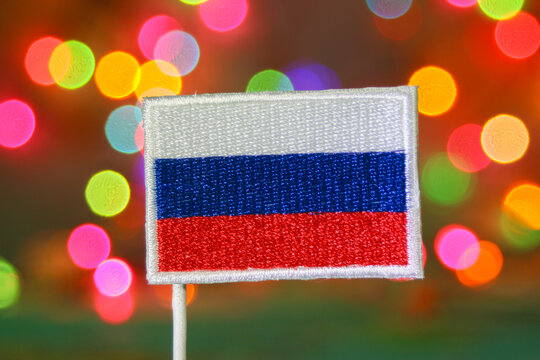 Russian national flag embroidery with colorful bokeh lights resembling fireworks, ideal for Christmas, New Year, or Independence Day celebrations. - Powered by Adobe