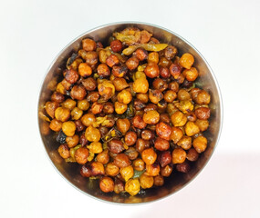 Spicy Roasted Black Chickpeas or Kala Chana in a Bowl with Spoon