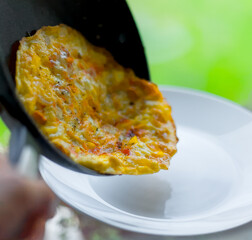 Crispy Summer Fried Omelette with Cheddar Cheese, Bell Peppers and Shallots on a Plate