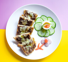 Top View of Grass Fed British Minced Beef Sourdough Sandwiches with Welsh Cheddar Cheese, Egg, Organic Cucumber and Shallots Art Flower