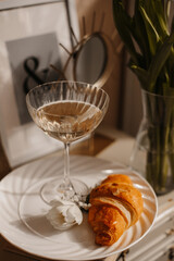 Elegant Breakfast with Champagne and Croissant