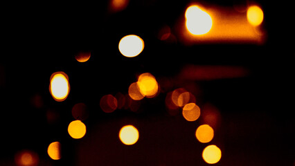 Defocused bokeh lights. Blurred abstract glitter texture. Background shining golden light