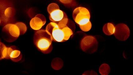 Defocused bokeh lights. Blurred abstract glitter texture. Background shining golden light