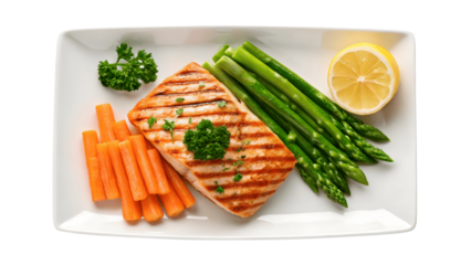 Grilled salmon with asparagus, carrots, and lemon on plate on transparent background