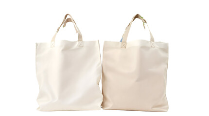 Two blank beige canvas tote bags isolated on a white background. Eco-friendly reusable shopping bag mockup for branding, design, or promotional purposes