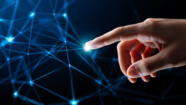 Photo of a human finger touches a glowing node in a complex blue digital network, symbolizing connection and innovation in technology