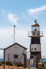 The old black and white lighthouse in the walled city of Old Acre, Akko Israel.
