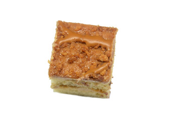 Biscuit cream topping on a small gateau cake, Gateau bites are small bite-sized portions of cake, made of various cake flavors and fillings, miniature cakes, Eclairs, mille feuille and sponge cake