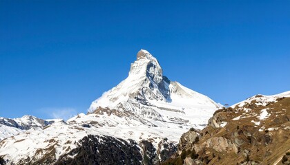 Iconic Matterhorn mountain peak in Switzerland with snowy summit. Perfect for travel posters, tourism branding, and adventure ads.
