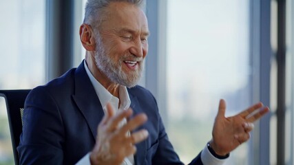 Aged manager enjoy videocall gesturing to laptop webcam in office closeup. - Powered by Adobe