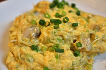 Chinese cuisine: stir-fried eggs, clams and leaf celery