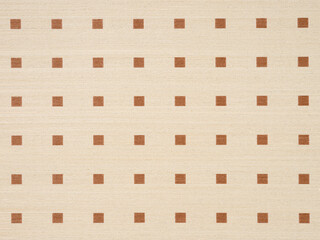 Warm beige veneer surface with a regular pattern of brown squares