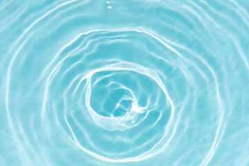 Blue water with ripples on the surface. Defocus blurred transparent blue colored clear calm water...