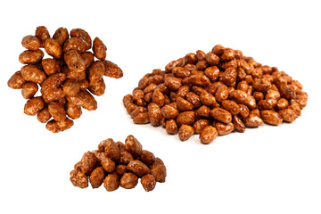Tasty sweet roasted peanuts isolated on a white background.