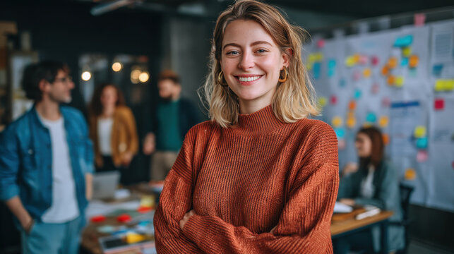 Confident woman smiles in modern office environment, surrounded by colleagues engaged in brainstorming session. atmosphere is collaborative and creative, showcasing teamwork and innovation