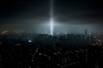 Fototapeta premium Aerial view captures vibrant cityscape illuminated by two beams of light at night. Mysterious atmosphere enhances urban serenity and hope.