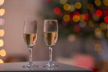 two glasses of champagne and christmas tree