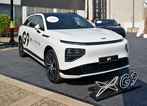 XPeng G9 electric SUV car is charging at an exhibition