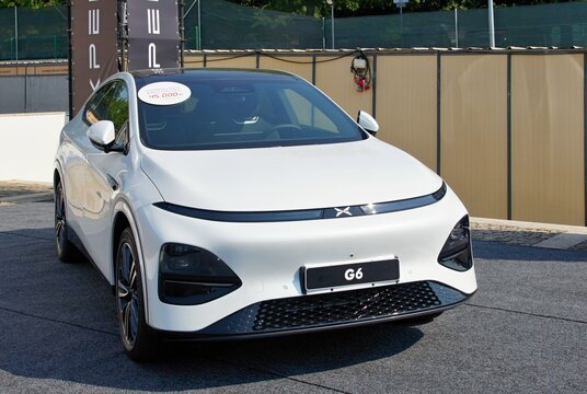XPeng G6 electric car parked at a dealership showcasing innovative design