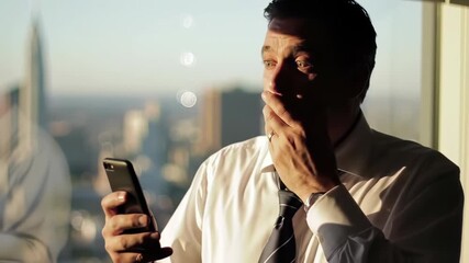 Worried businessman in white shirt holds smartphone looking at screen in office, concept for financial loss, business downturn and investment analysis - Powered by Adobe