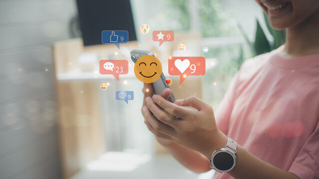 Young person using smartphone with floating social media icons, likes, comments, and emoji reactions, concept of online reputation management, digital marketing, and social engagement.