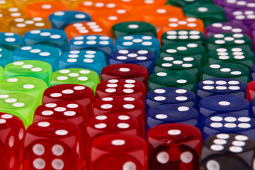 A close-up view reveals a set of dice in various colors.