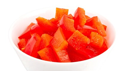 A white bowl filled with diced red bell peppers