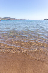 Water and sand at the Bosa Marina beach.