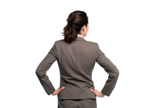 Asian female adult in business suit from behind with hands on hips
