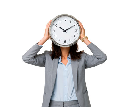 Female adult in gray suit holding wall clock over face on black background